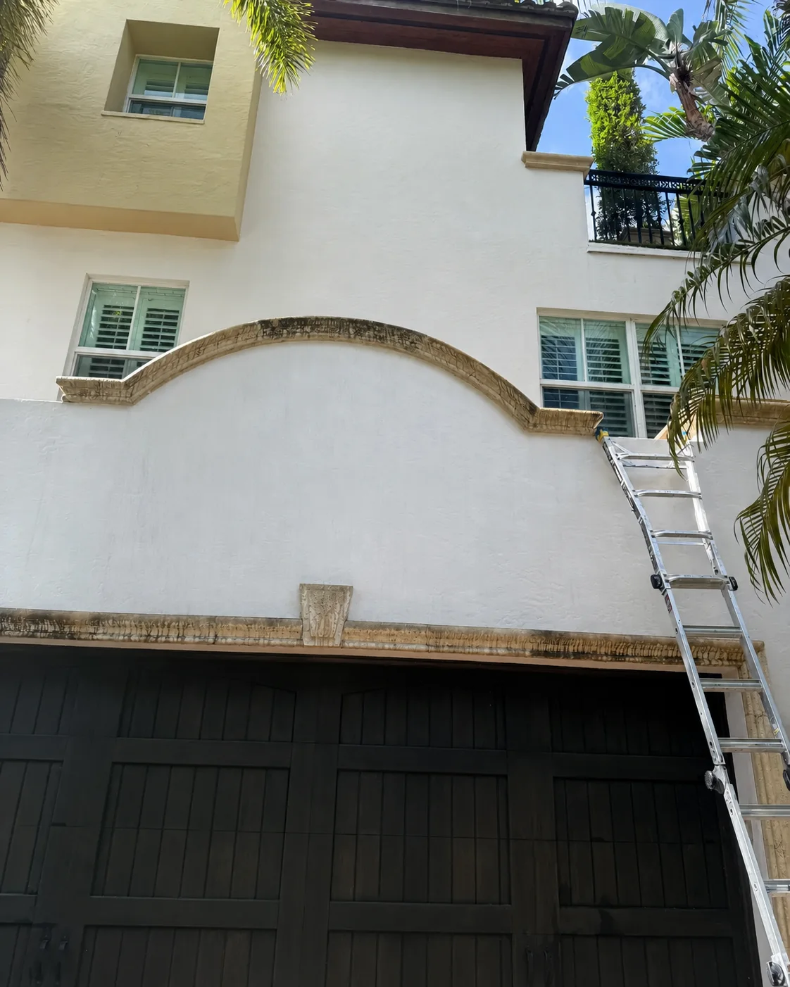 Stucco home exterior before professional cleaning