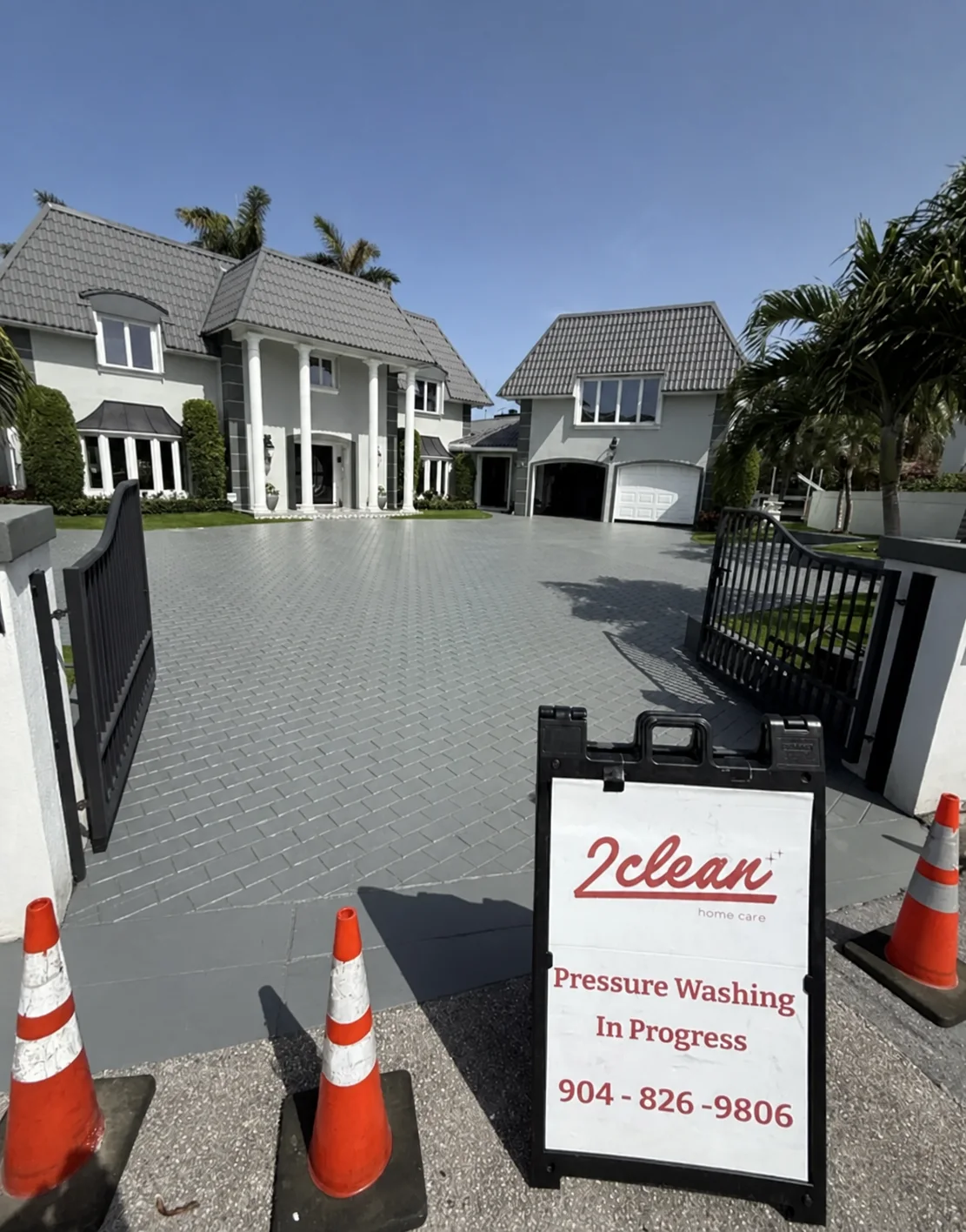 Residential paver driveway during a professional pressure-washing visit