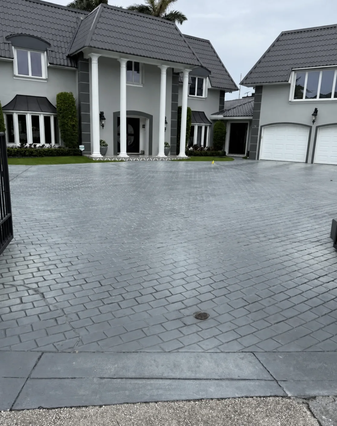 Residential paver driveway after professional exterior cleaning